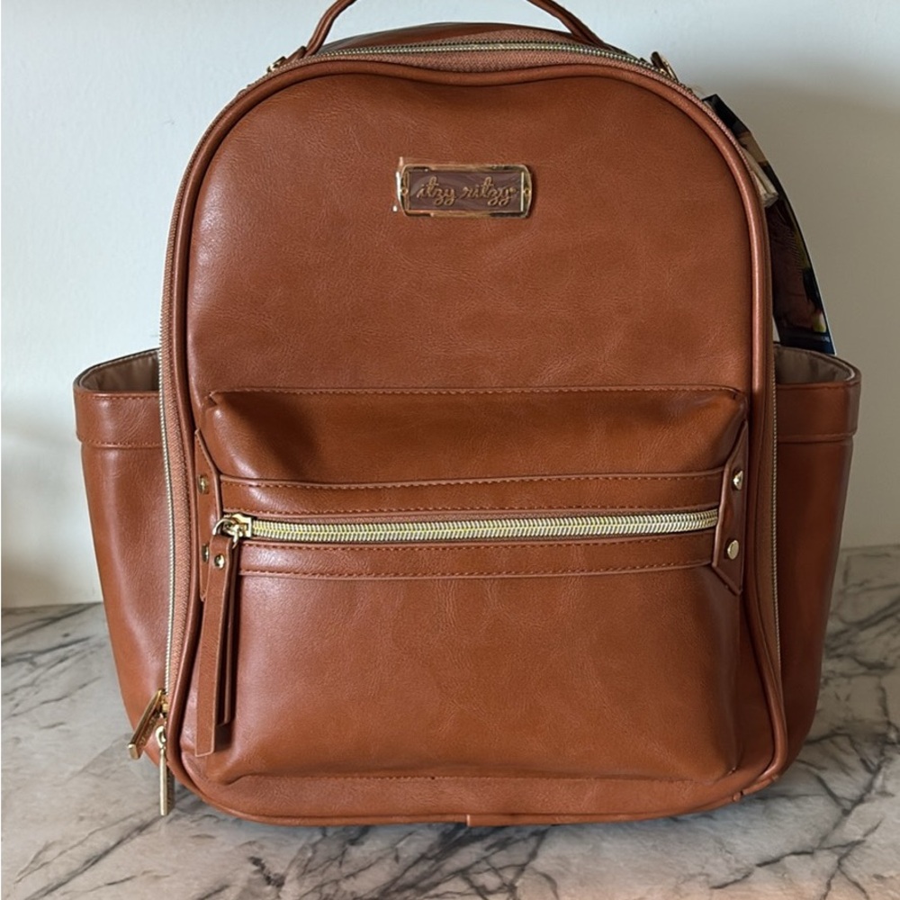 Itzy Ritzy Tan Backpack with Metallic Hardware